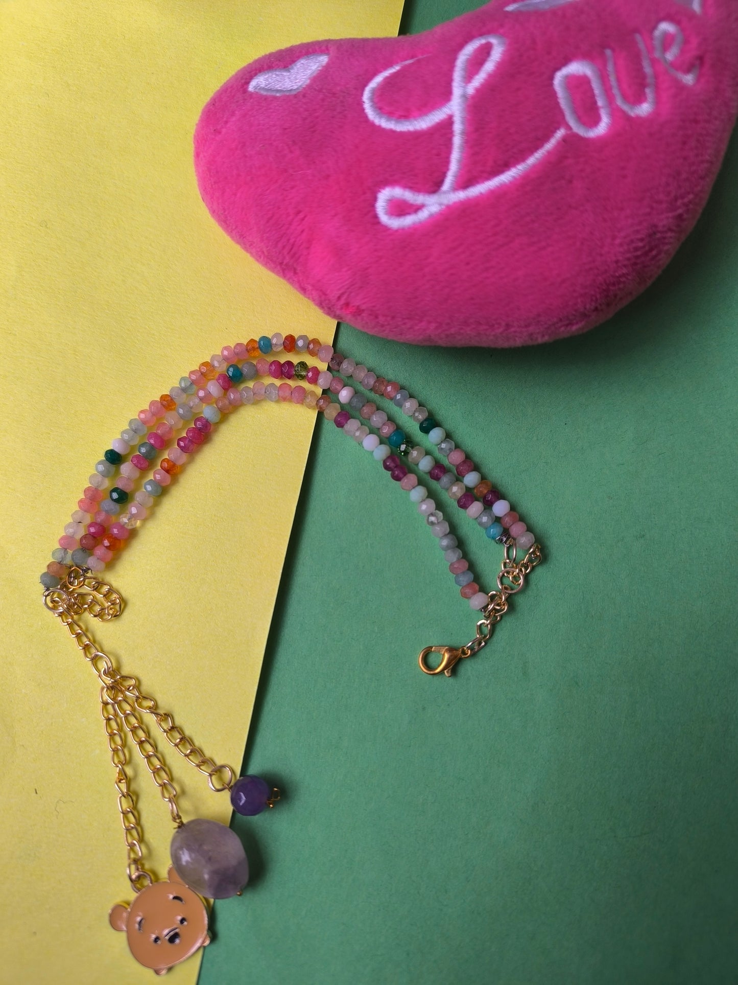 Faceted beads with charm tassel