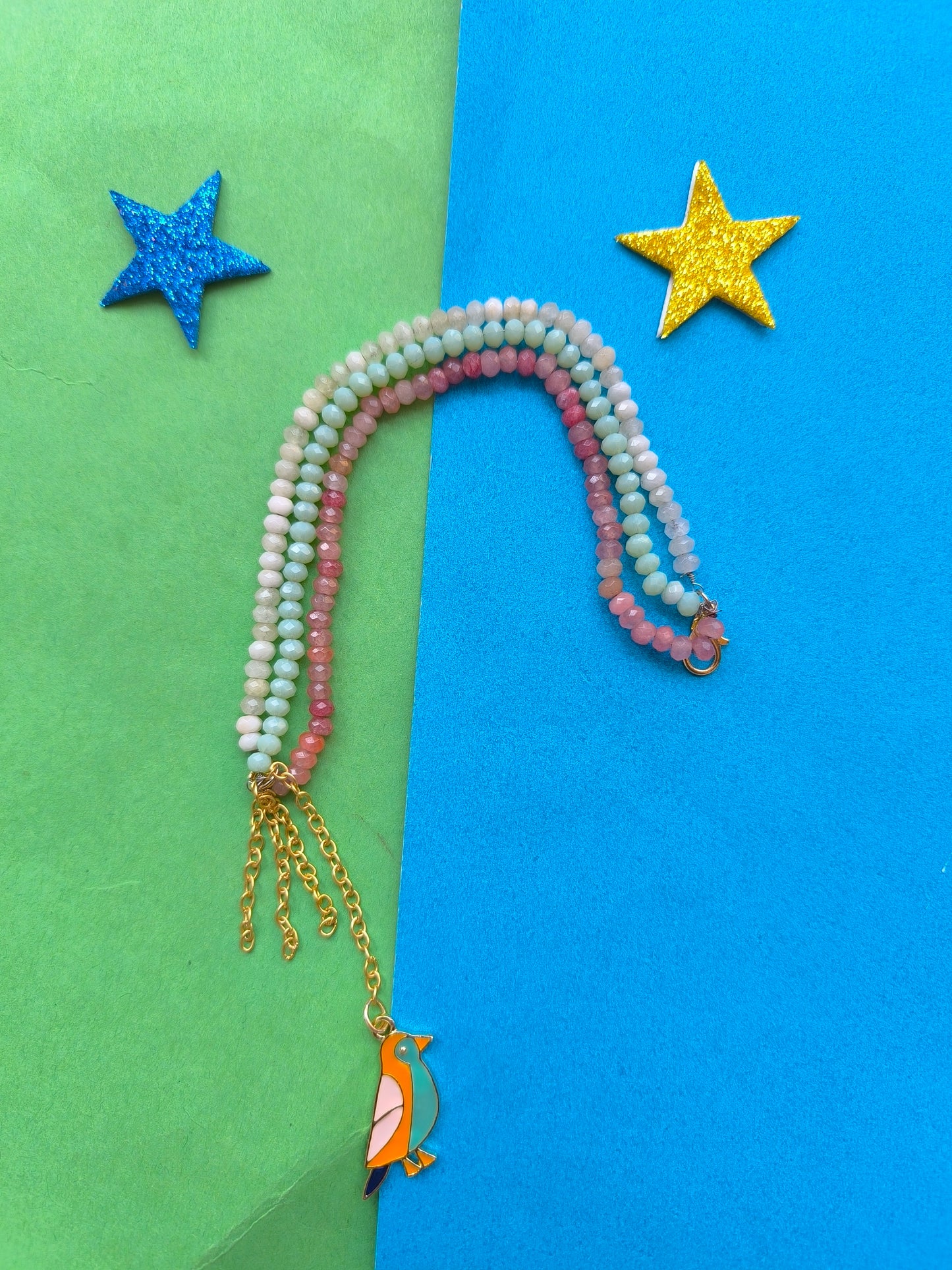 Facetd beads with charm tassel