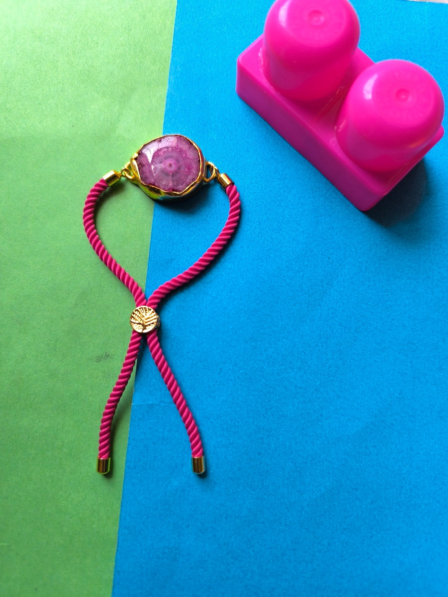 Pink agate stone with thread