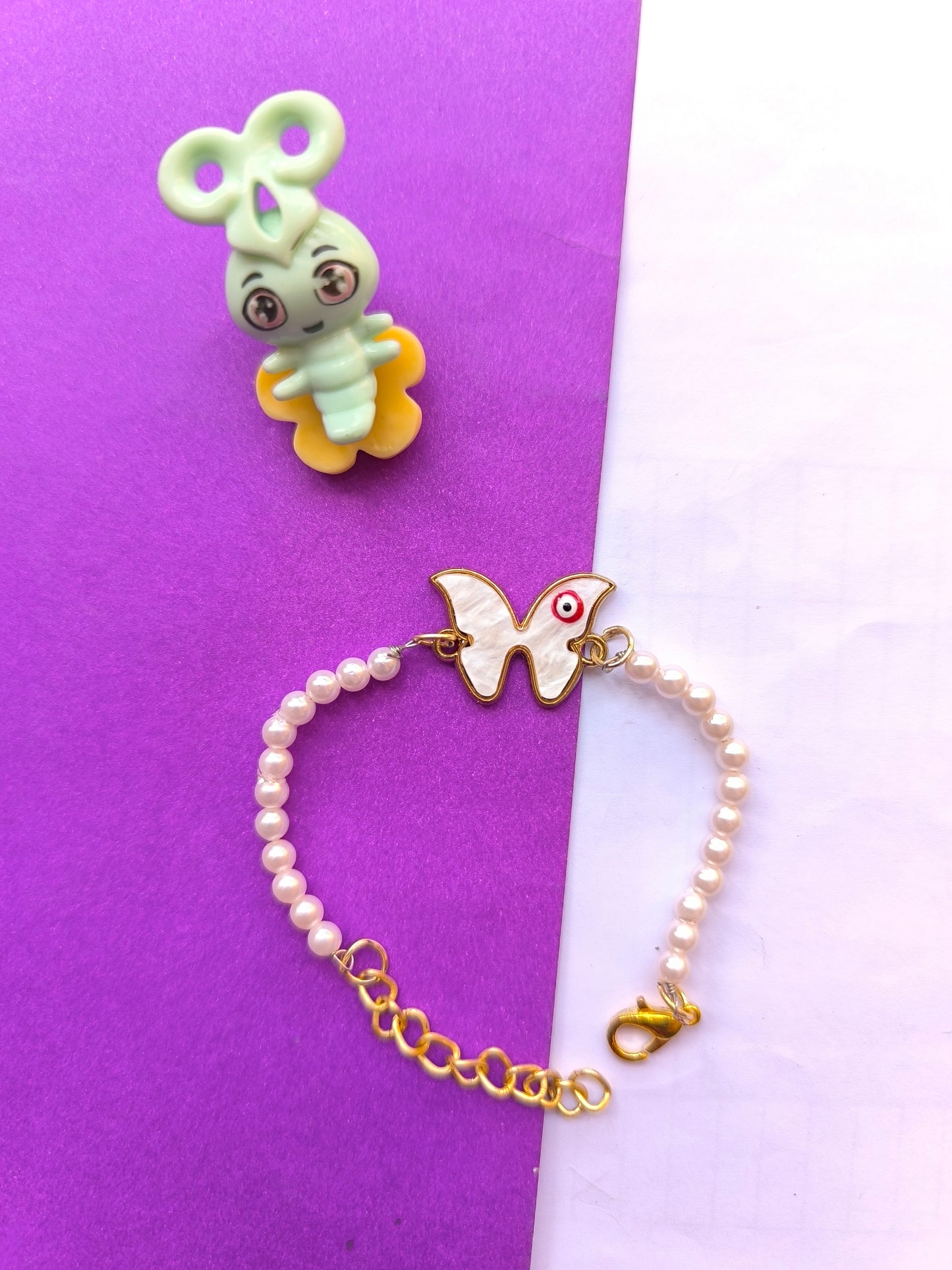 Butterfly charm and pearl rakhi