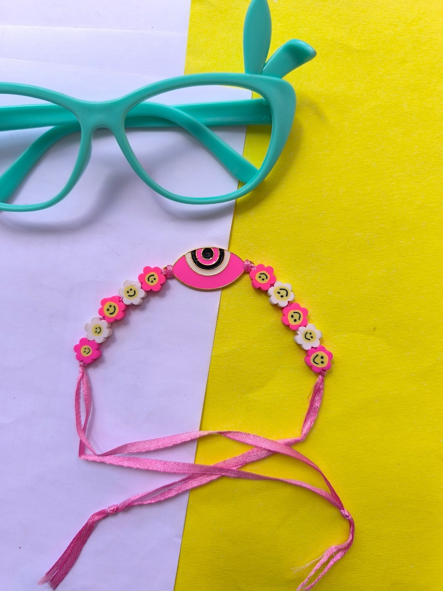 Pink evil eye with breads and thread