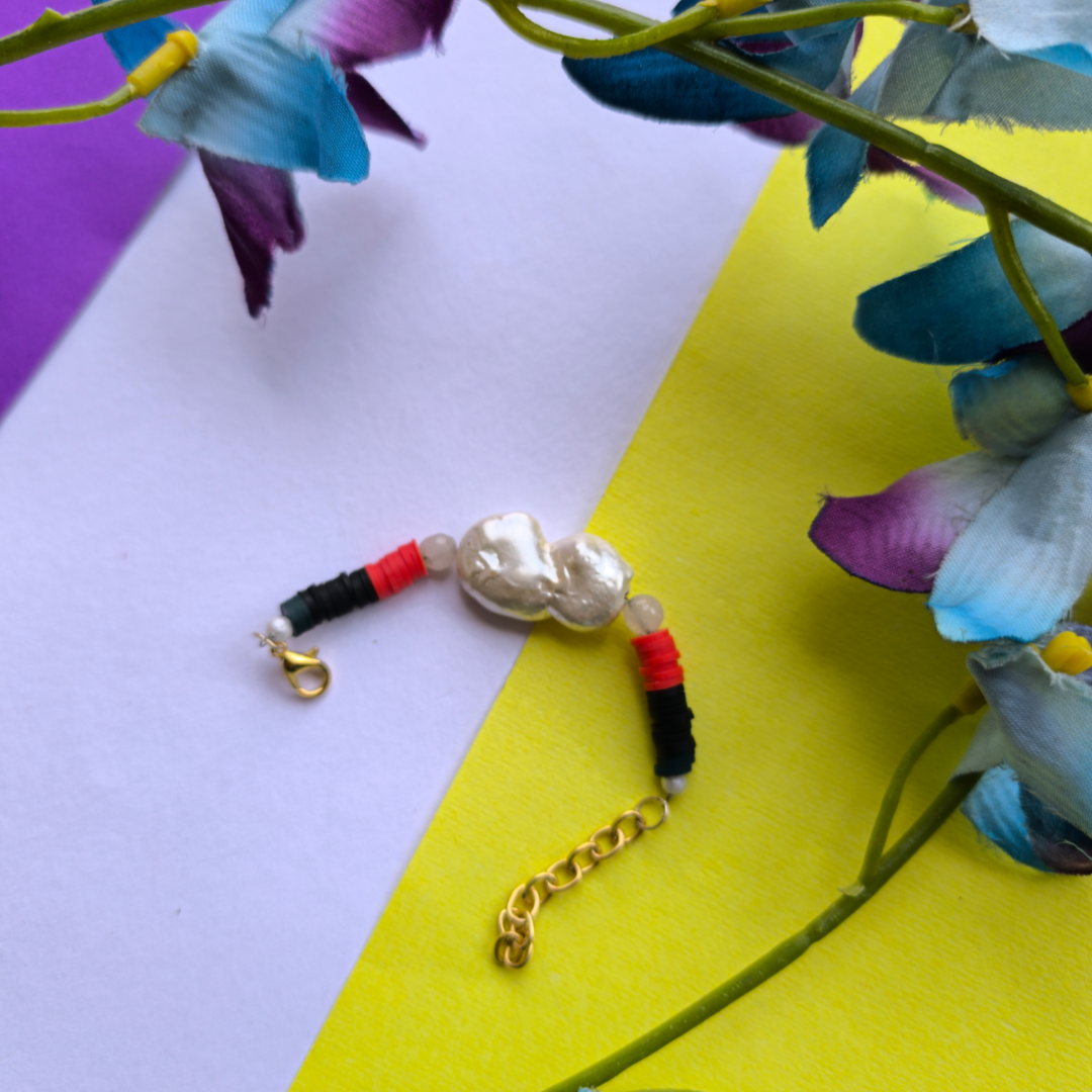 PEARL WITH RED AND BLACK BEADS