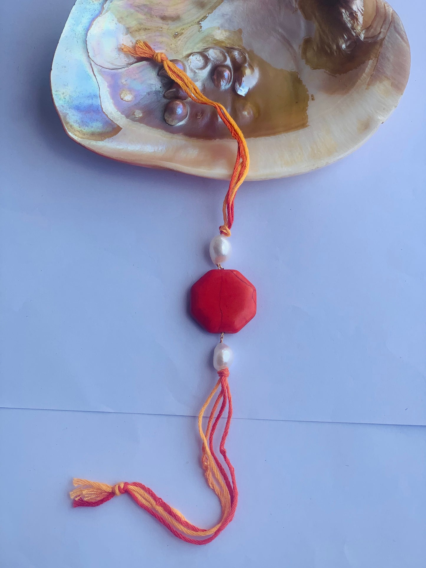 Orange coral with pearl mauli rakhi