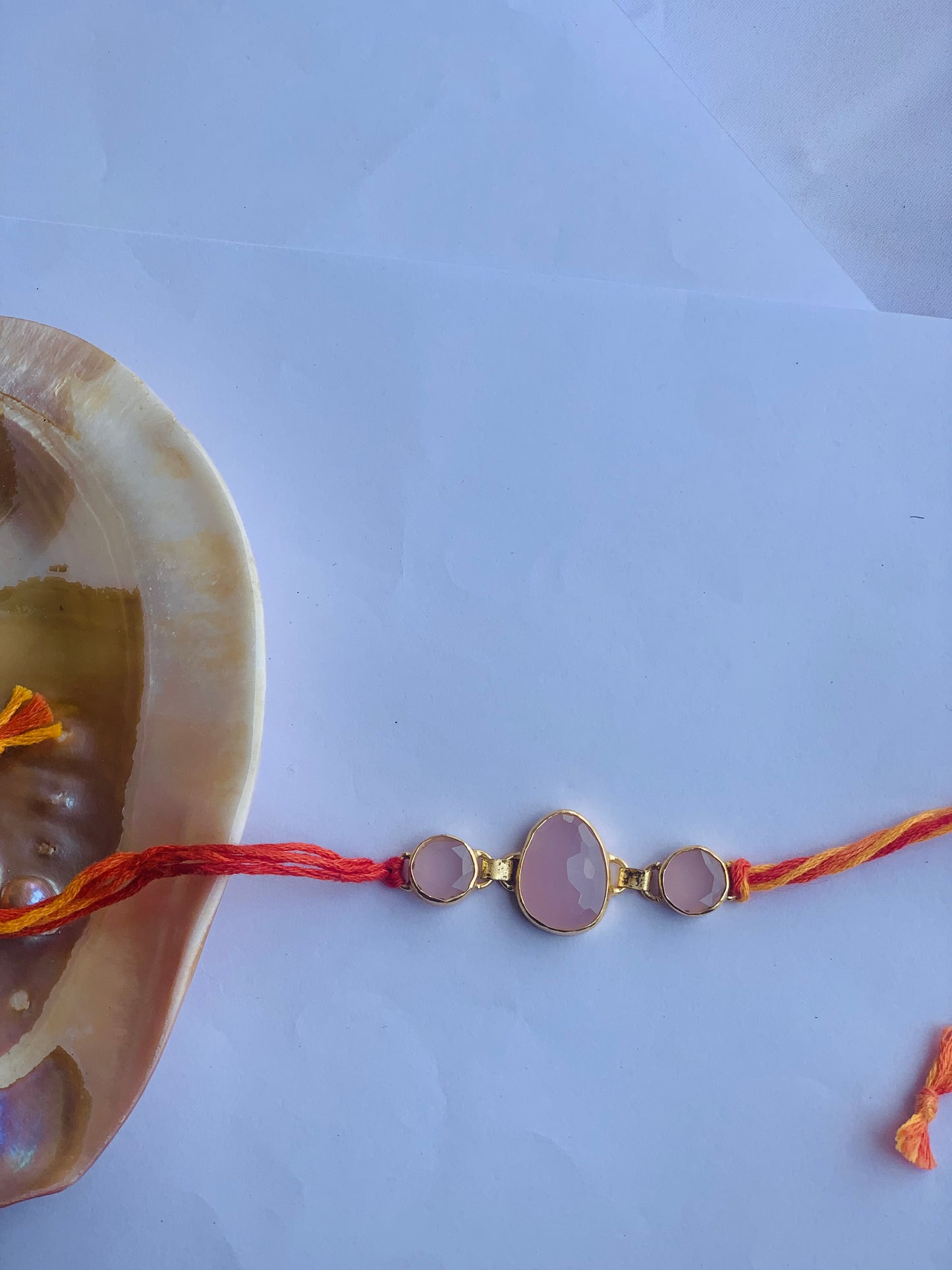 Rose quartz stone in mauli