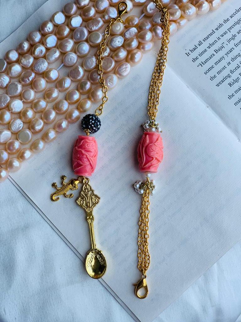 Orange Carved Stone Couple Rakhi