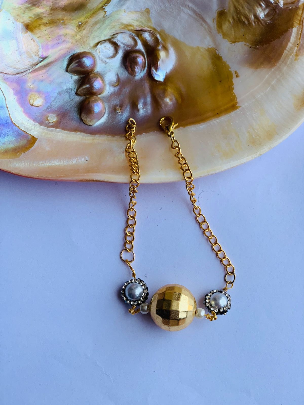 Golden ball in turkish zircon in chain