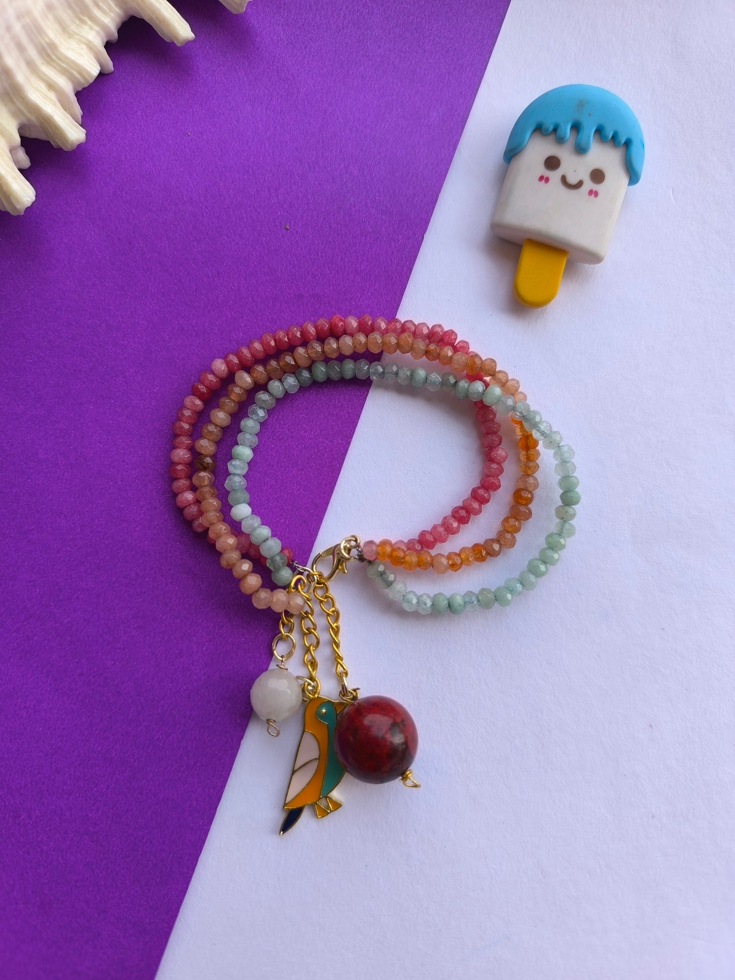 Faceted beads with tassel charm bracelet