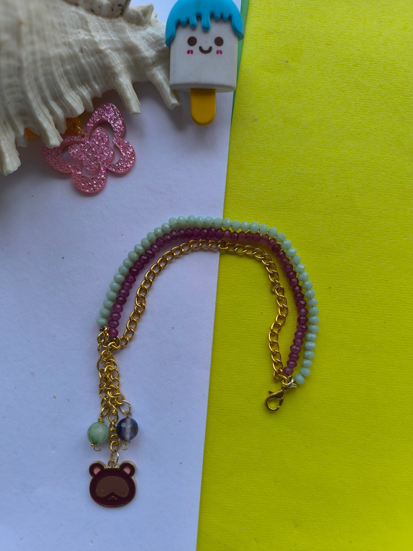 Faceted beads with charm tassel