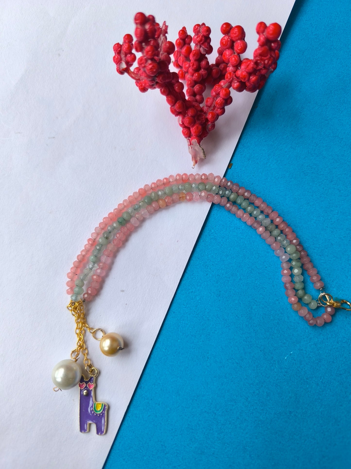 Faceted beads with stone charm tassel