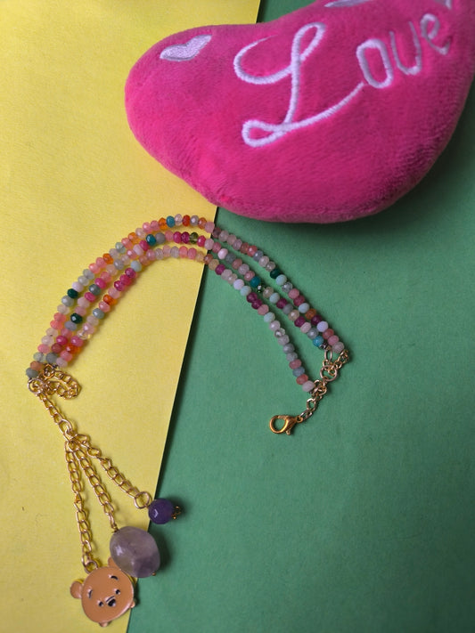 Faceted beads with charm tassel