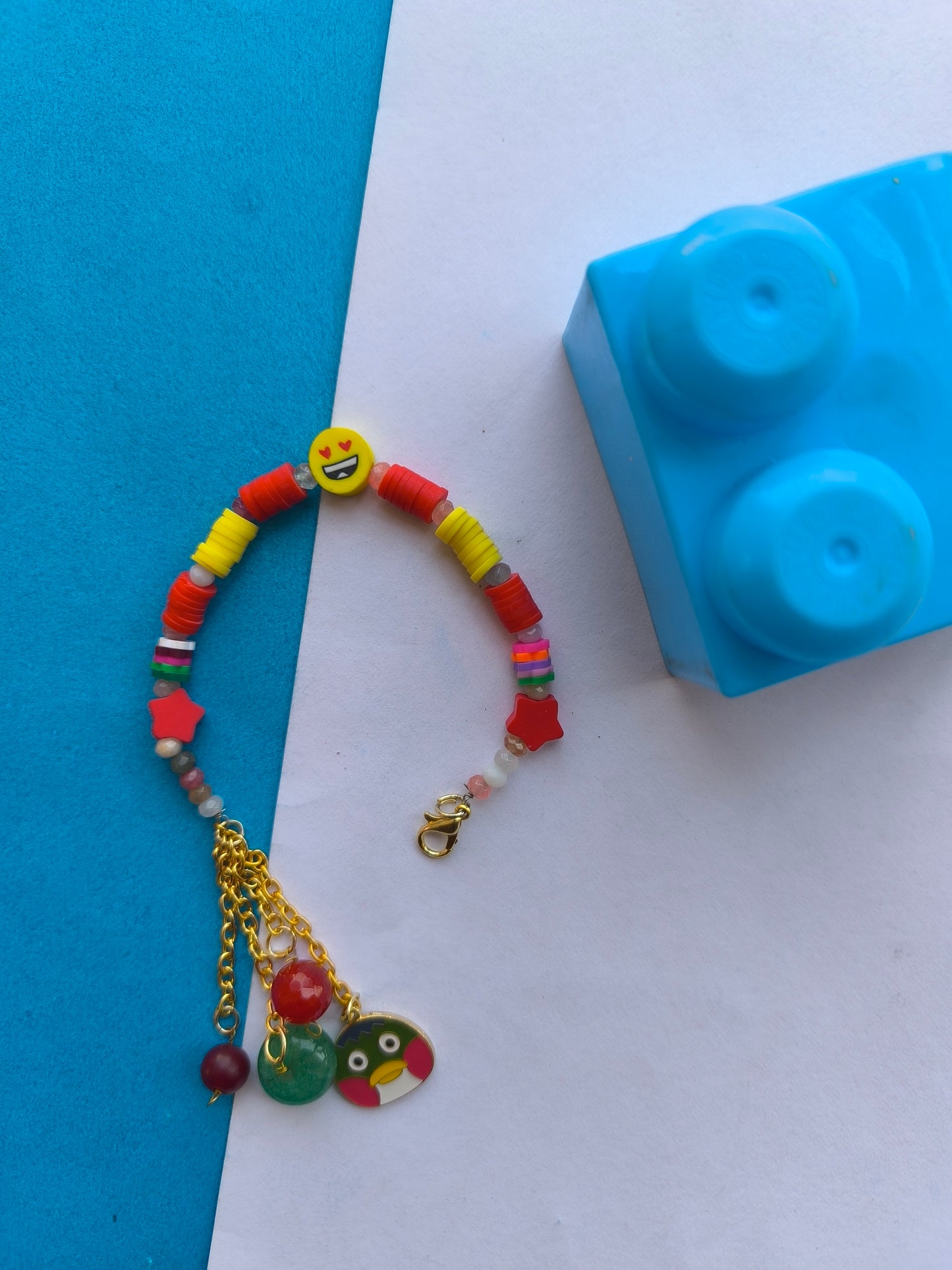 Red beads with smiley charm bracelet