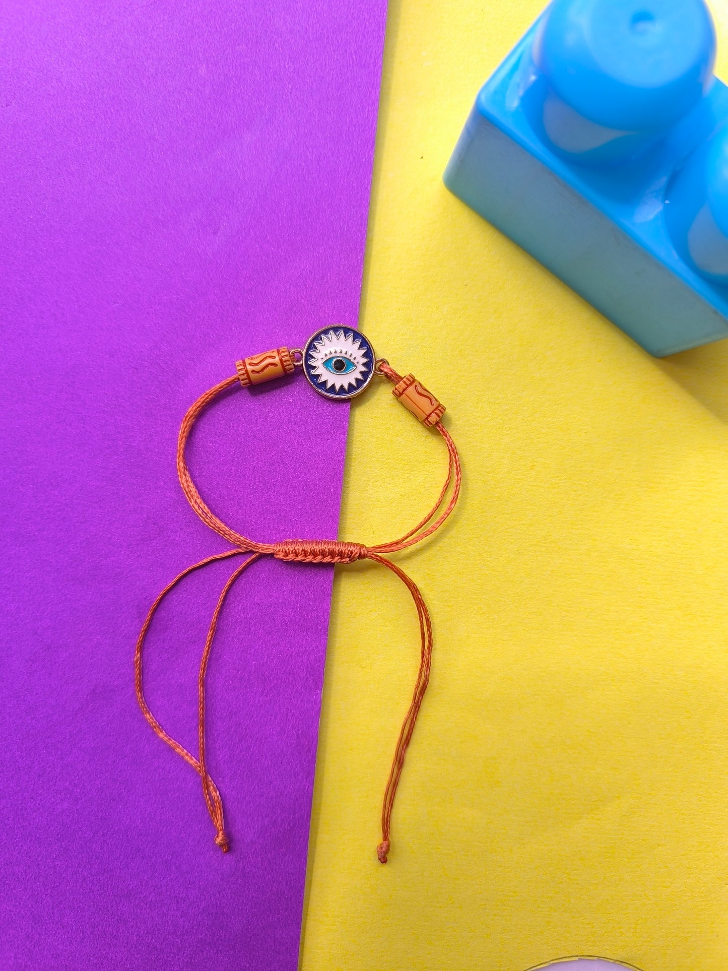 Blue Evil eye charm with brown thread