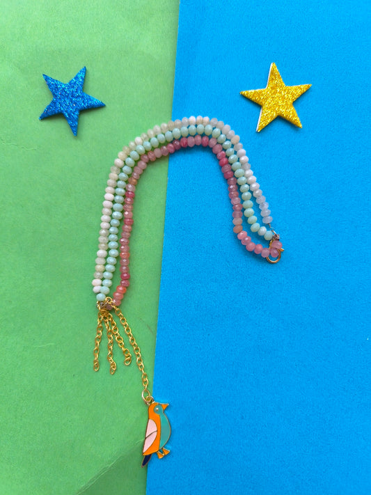 Facetd beads with charm tassel