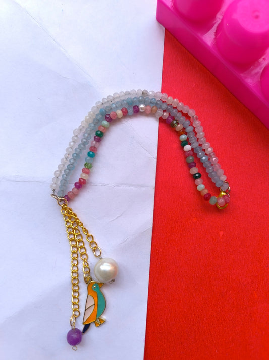 Faceted beads with charm tassel