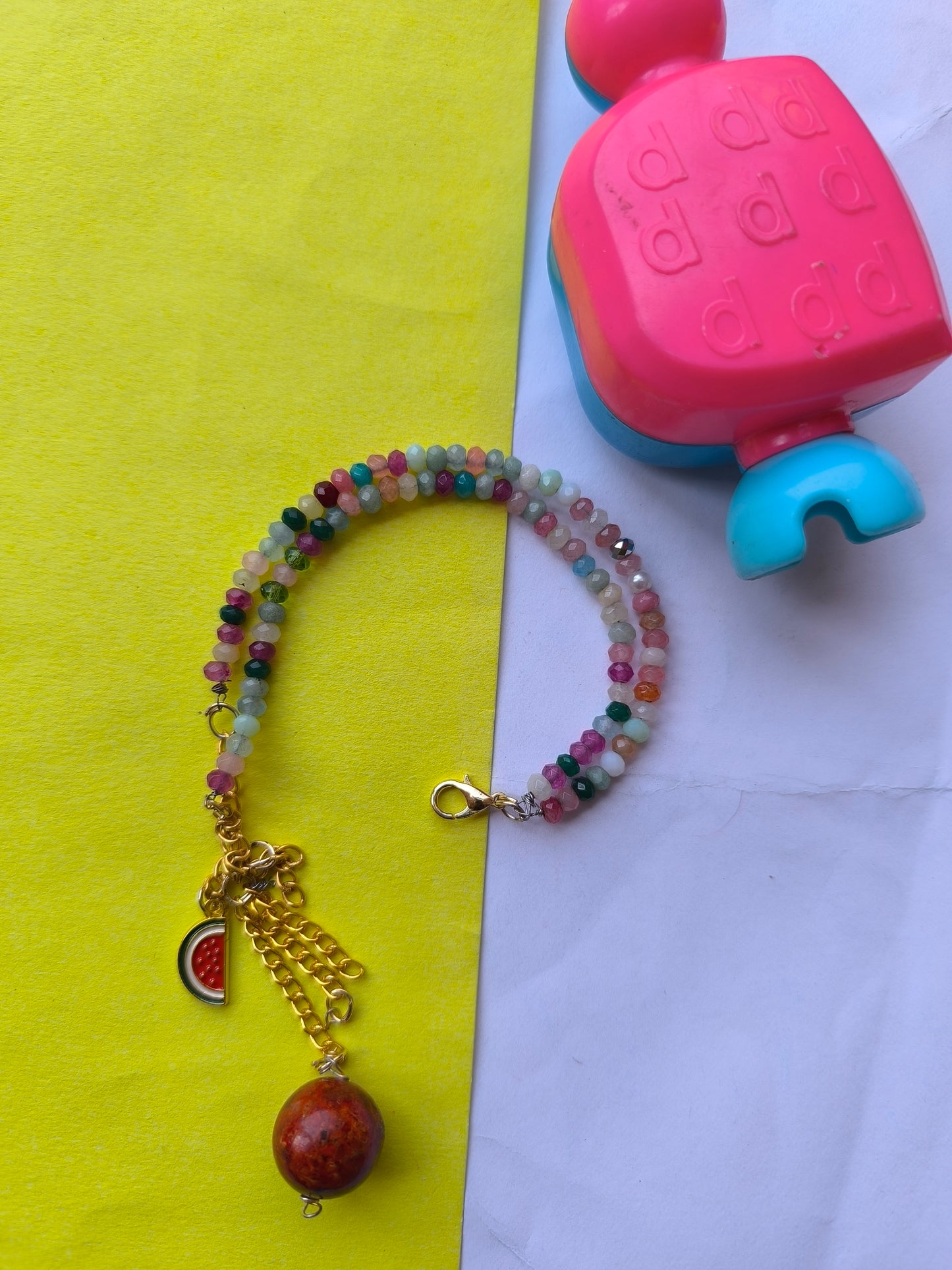 Faceted beads with charm hanging