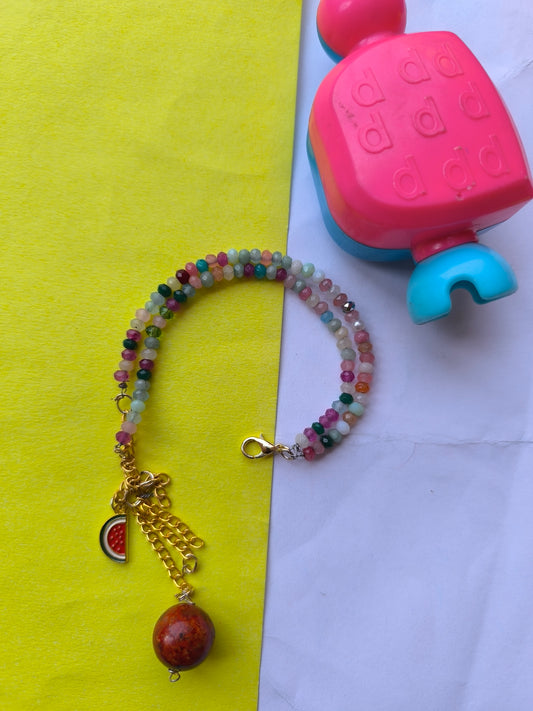 Faceted beads with charm hanging