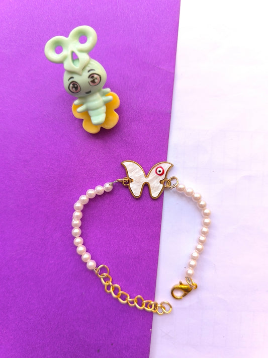 Butterfly charm and pearl rakhi