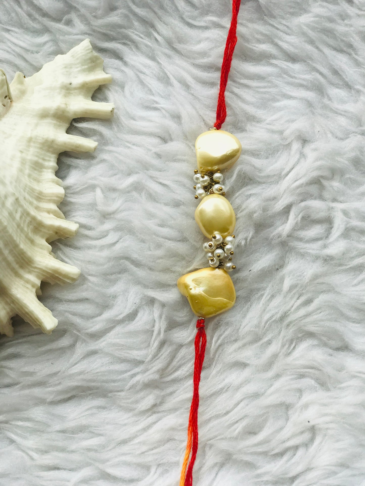 Yellow pearl with mauli rakhi