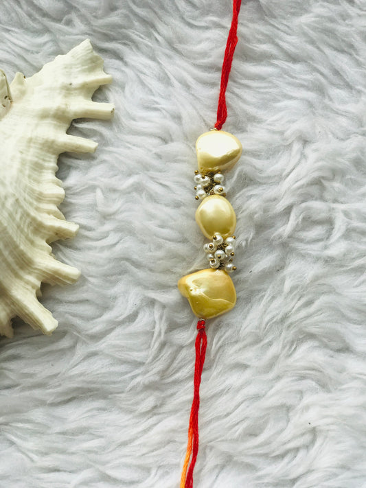 Yellow pearl with mauli rakhi