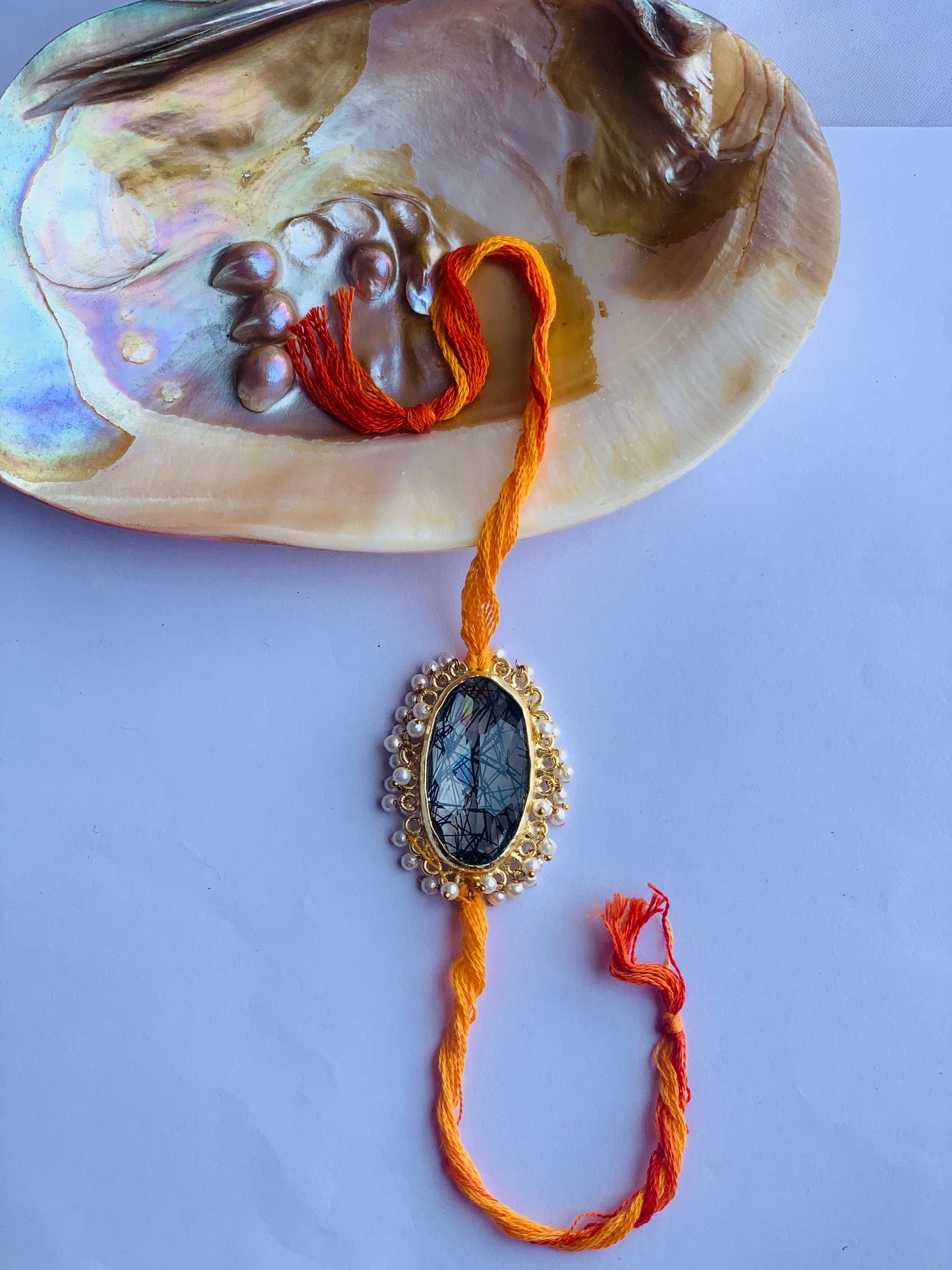 Rutile stone with pearl beaded mauli rakhi