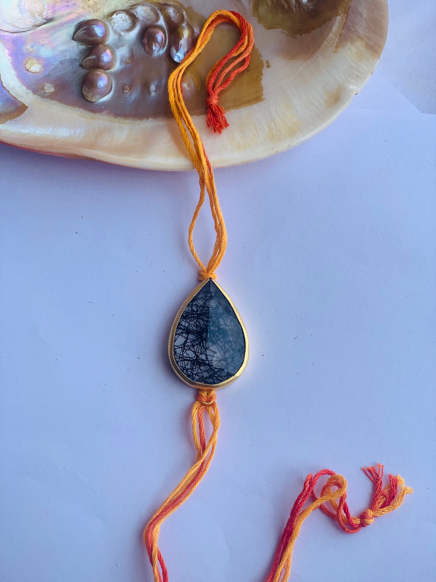 Rutile stone with mauli rakhi