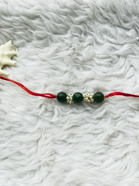 Green onyx stone with pearl mauli rakhi