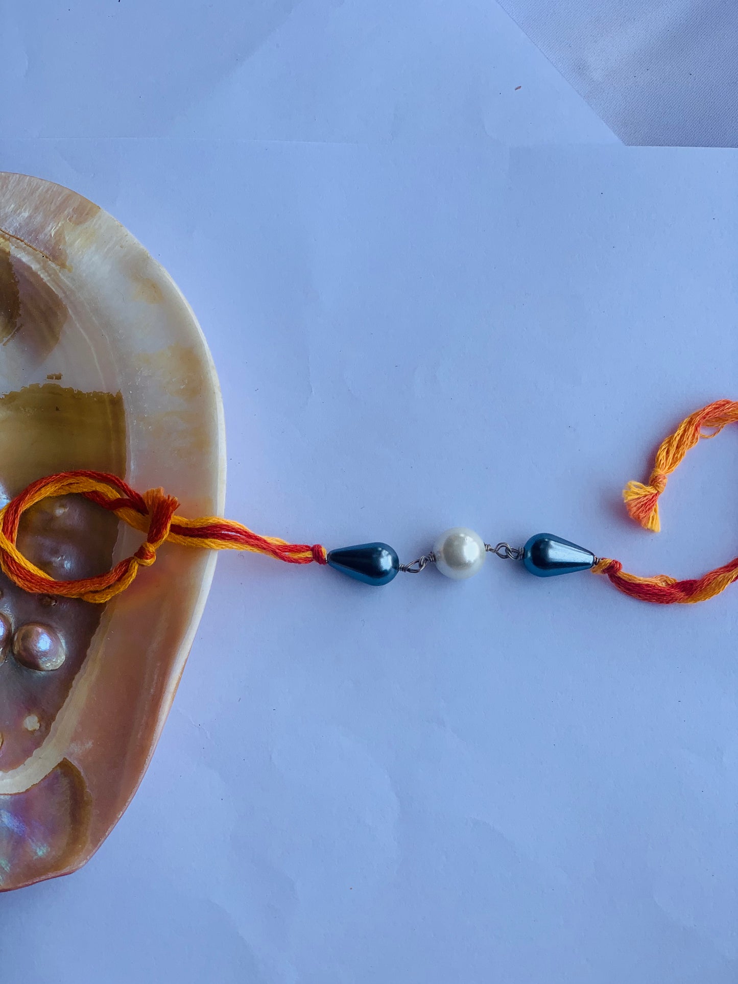 Grey & White pearl in mauli thread