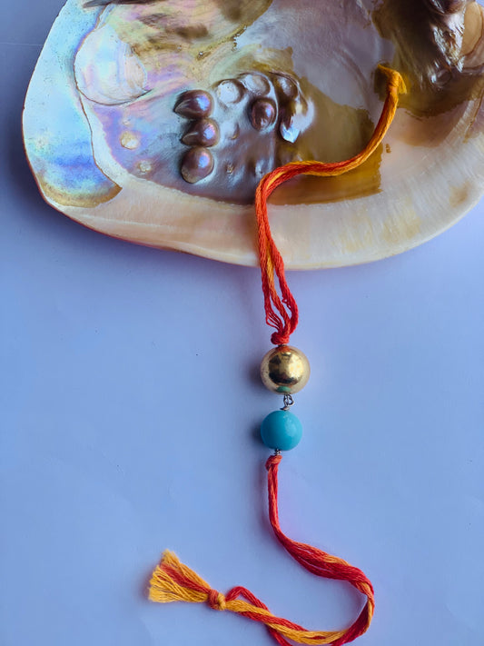 tourquise stone & golden ball in mauli thread