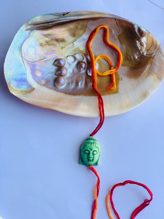 Buddha tourquise stone in mauli thread